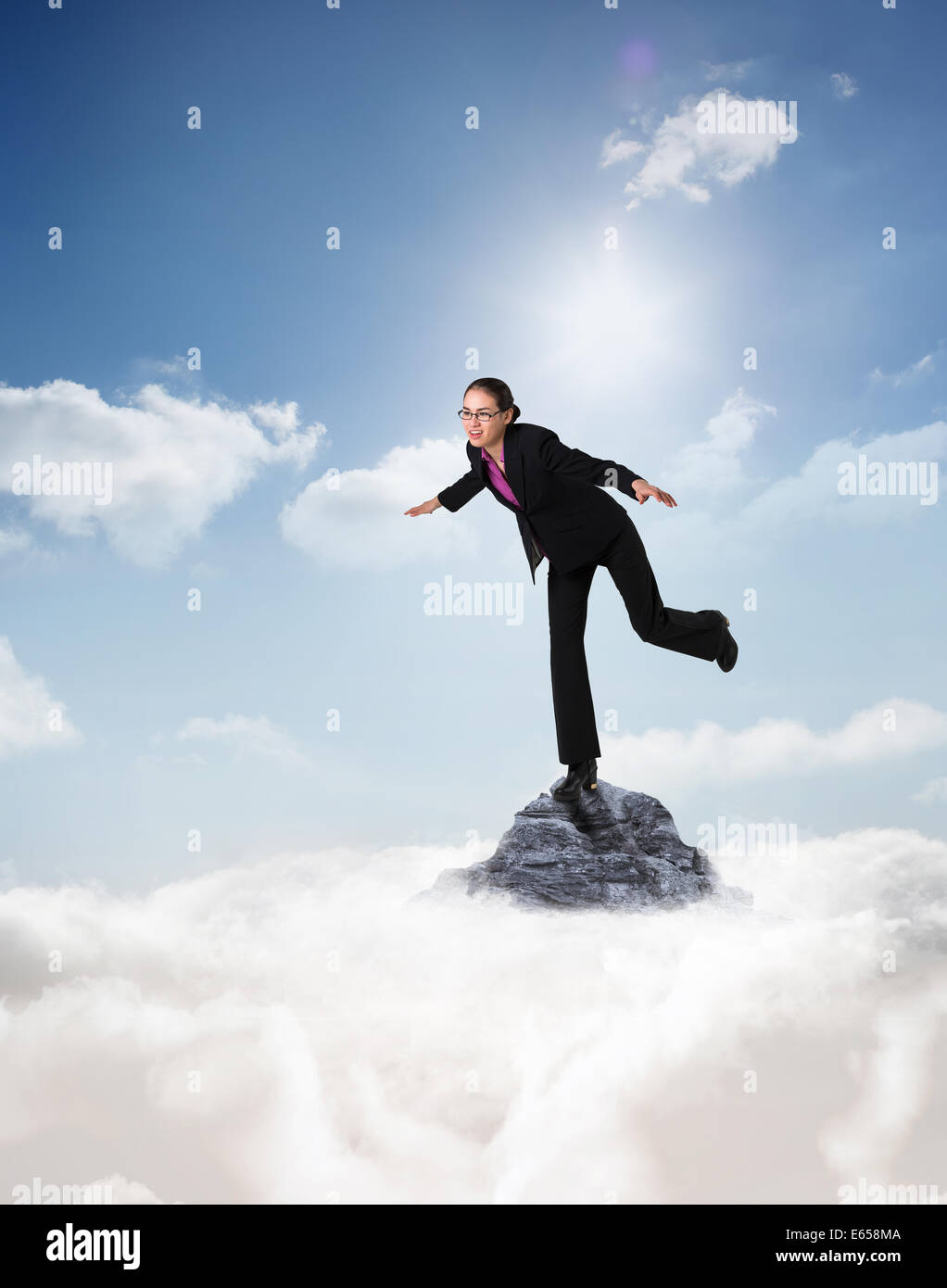 Composite image of businesswoman stepping et équilibrage Banque D'Images