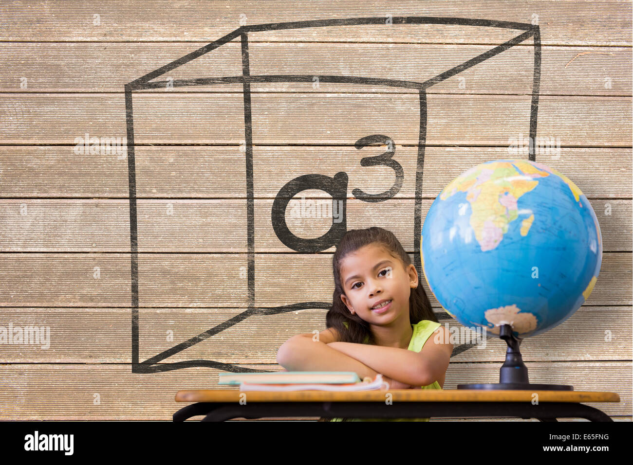 Image composite de cute pupils sitting at desk Banque D'Images
