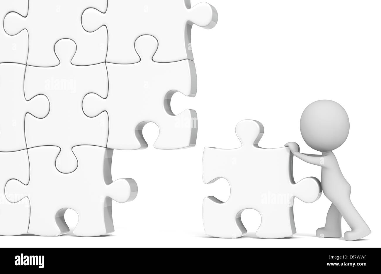 Le mec l'assemblage blanc grand puzzle. Banque D'Images