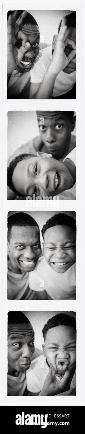 Père et fils smiling bubbles photo Banque D'Images