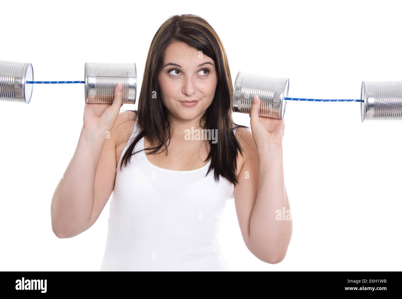 Jeune femme isolée en blanc holding. Les concepts de communication ou de la décision. Banque D'Images