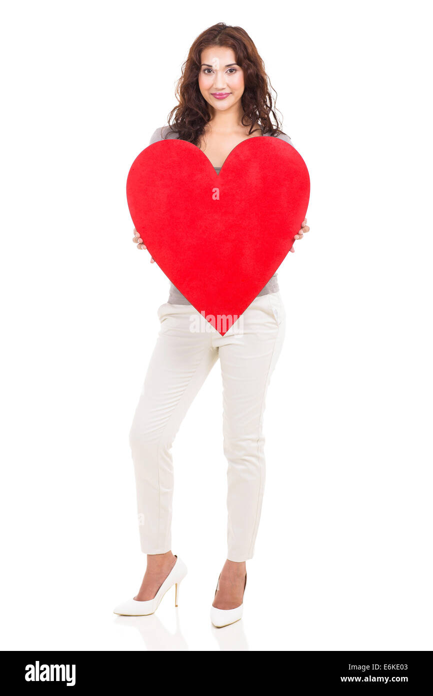 Belle Jeune femme tenant big red heart shape Banque D'Images
