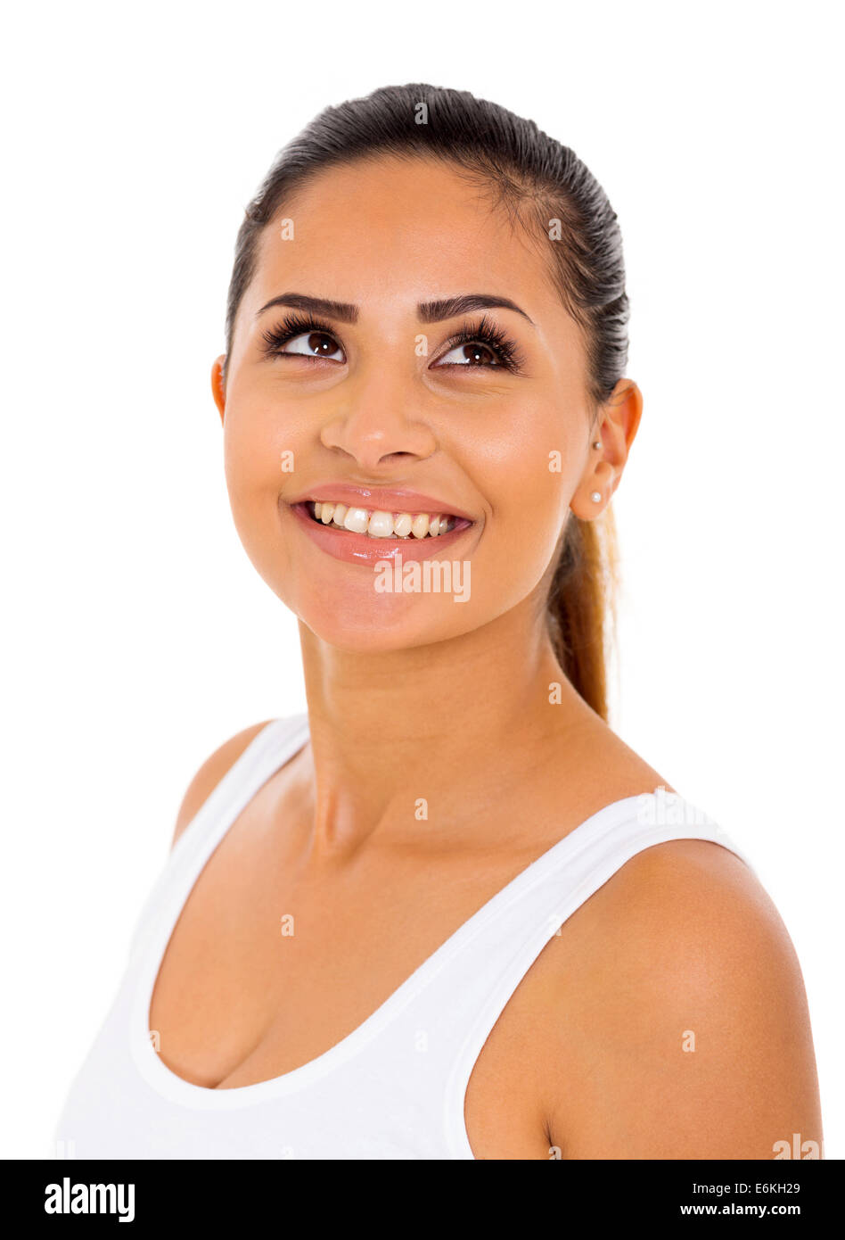 Beautiful young woman looking up on white background Banque D'Images