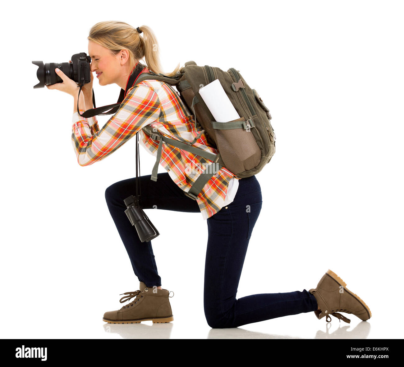 Woman sur son genou pour prendre des photos Banque D'Images