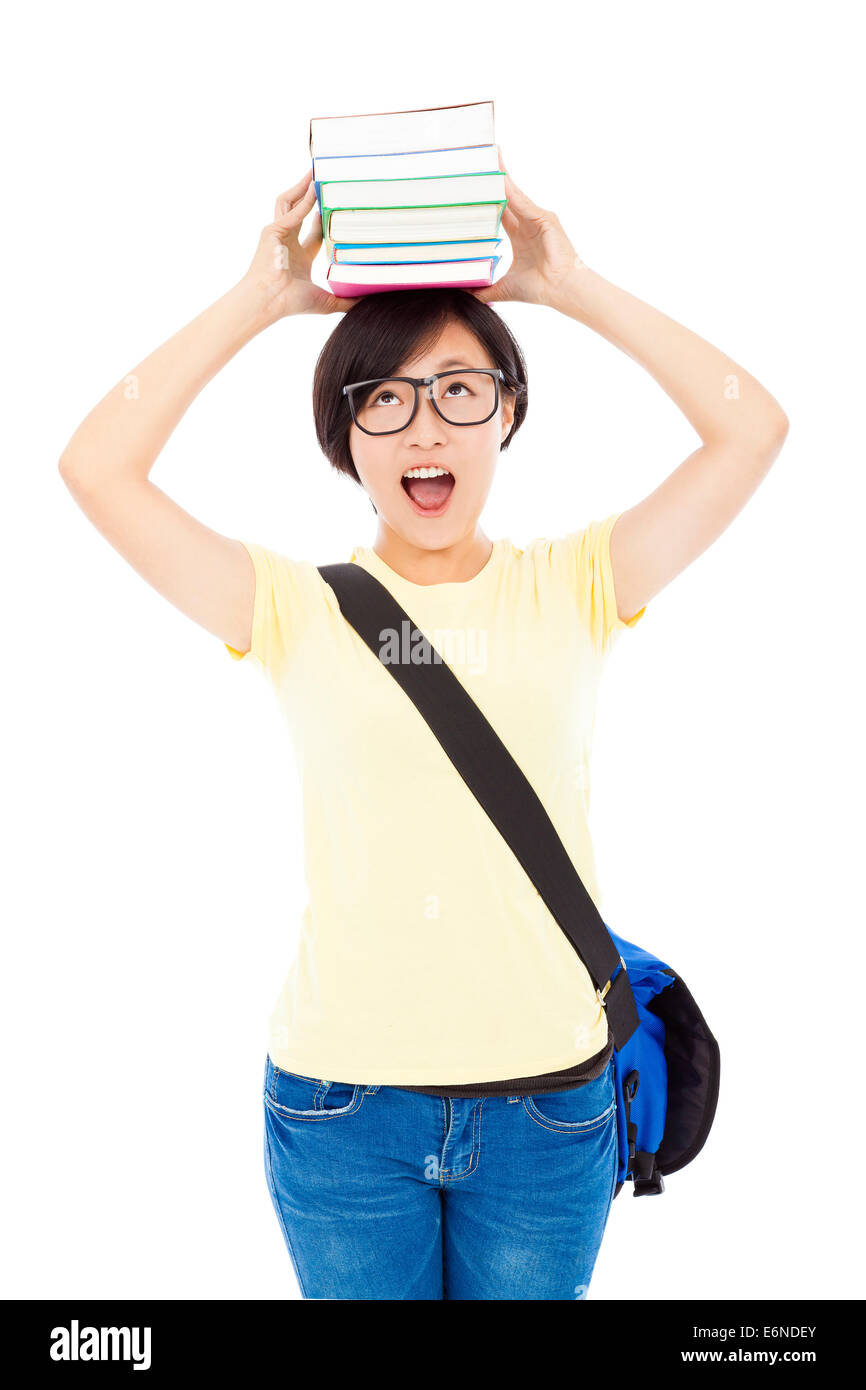 Jolie étudiante université girl holding livre sur la tête Banque D'Images