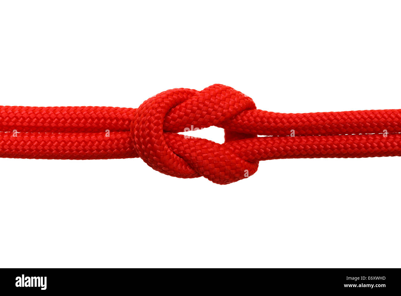 Dans un noeud de corde rouge isolé sur fond blanc. Banque D'Images