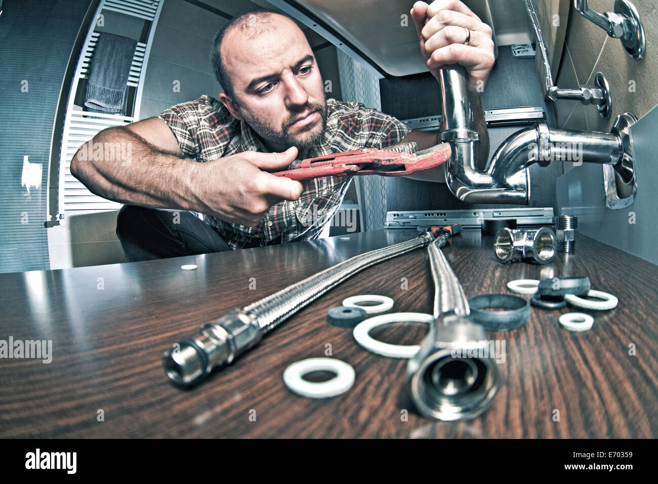 Portrait de plombier au travail Banque D'Images