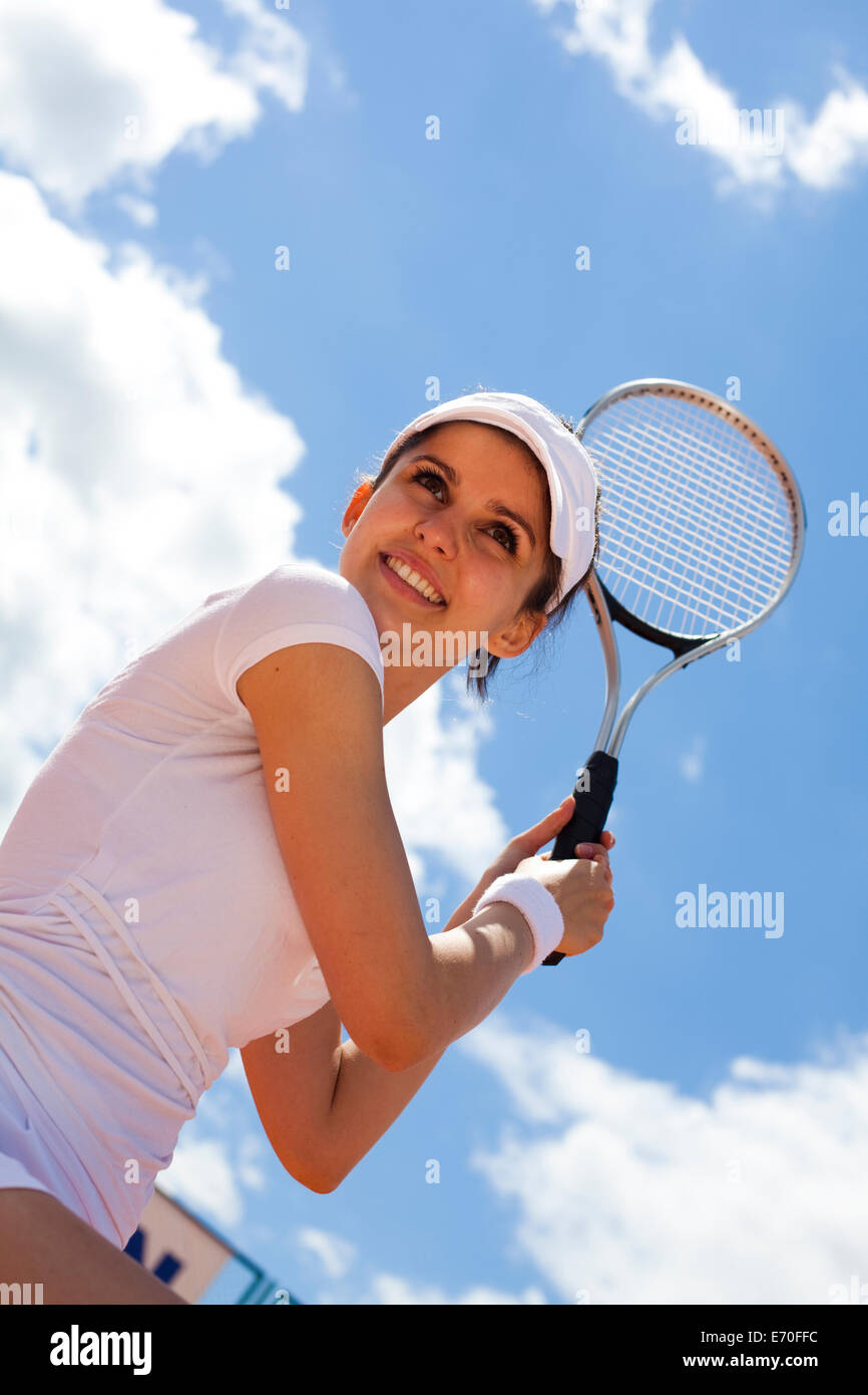 Jeune Femme Jouant Au Tennis Photo stock - Image du joueur, blanc: 20330262