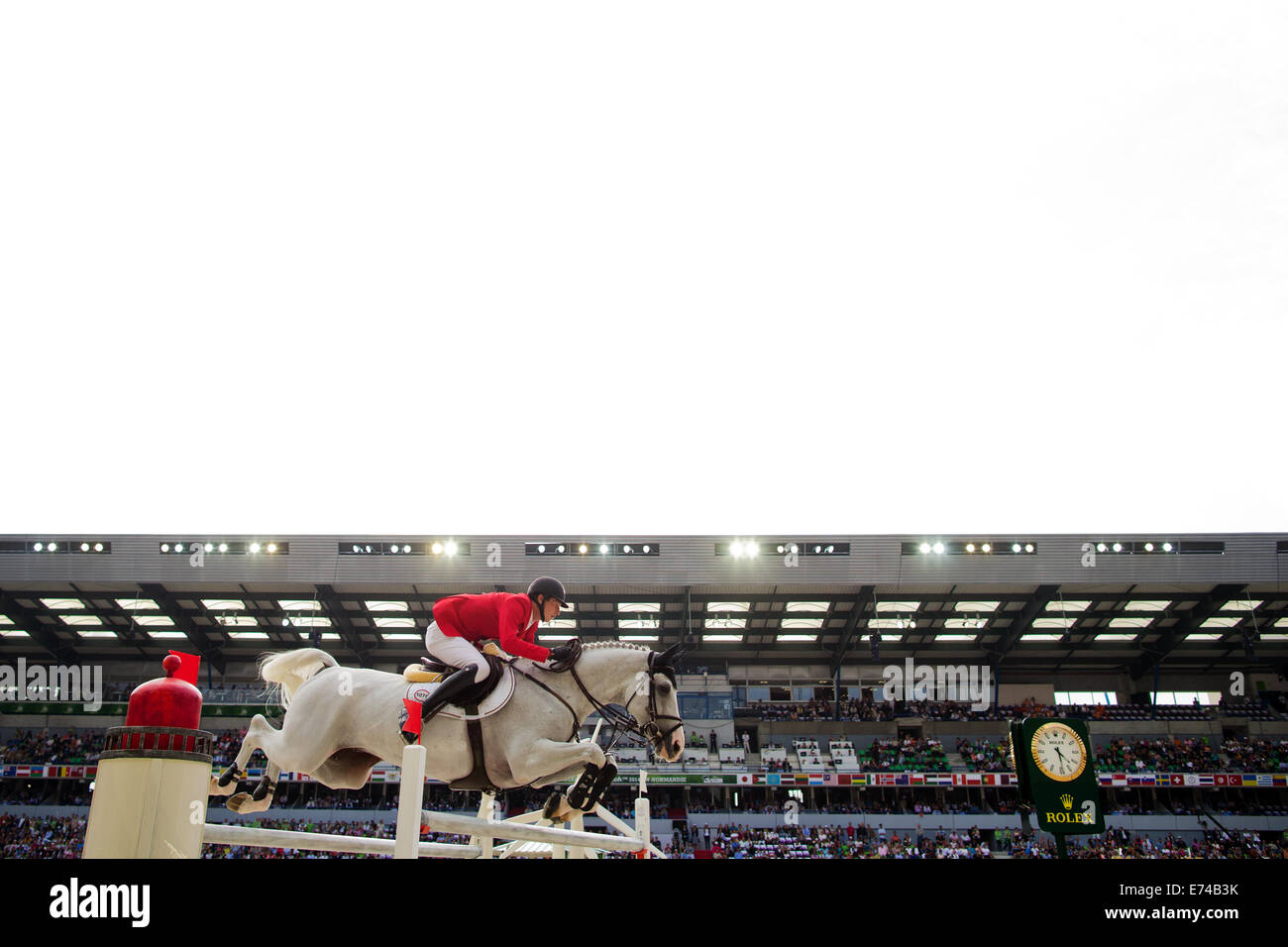 Caen, France. 06 Sep, 2014. Rider Daniel Deusser de l'Allemagne sur l 'Cornet D'Amour' participe à la compétition de saut de vitesse lors des Jeux équestres mondiaux 2014 à Caen, France, 06 septembre 2014. Photo : Rolf Vennenbernd/dpa/Alamy Live News Banque D'Images