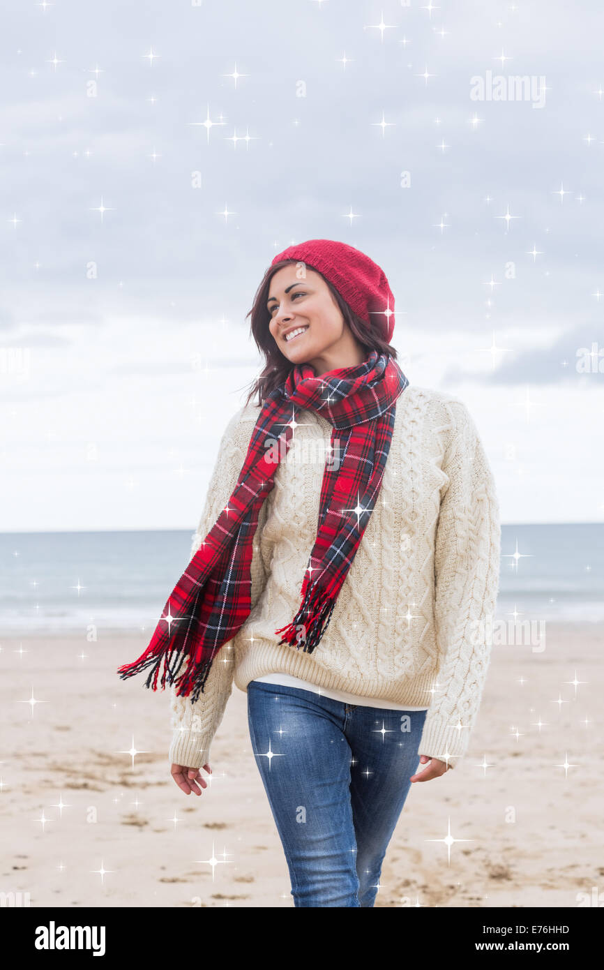 Image composite de woman in stylish warm clothing at beach Banque D'Images