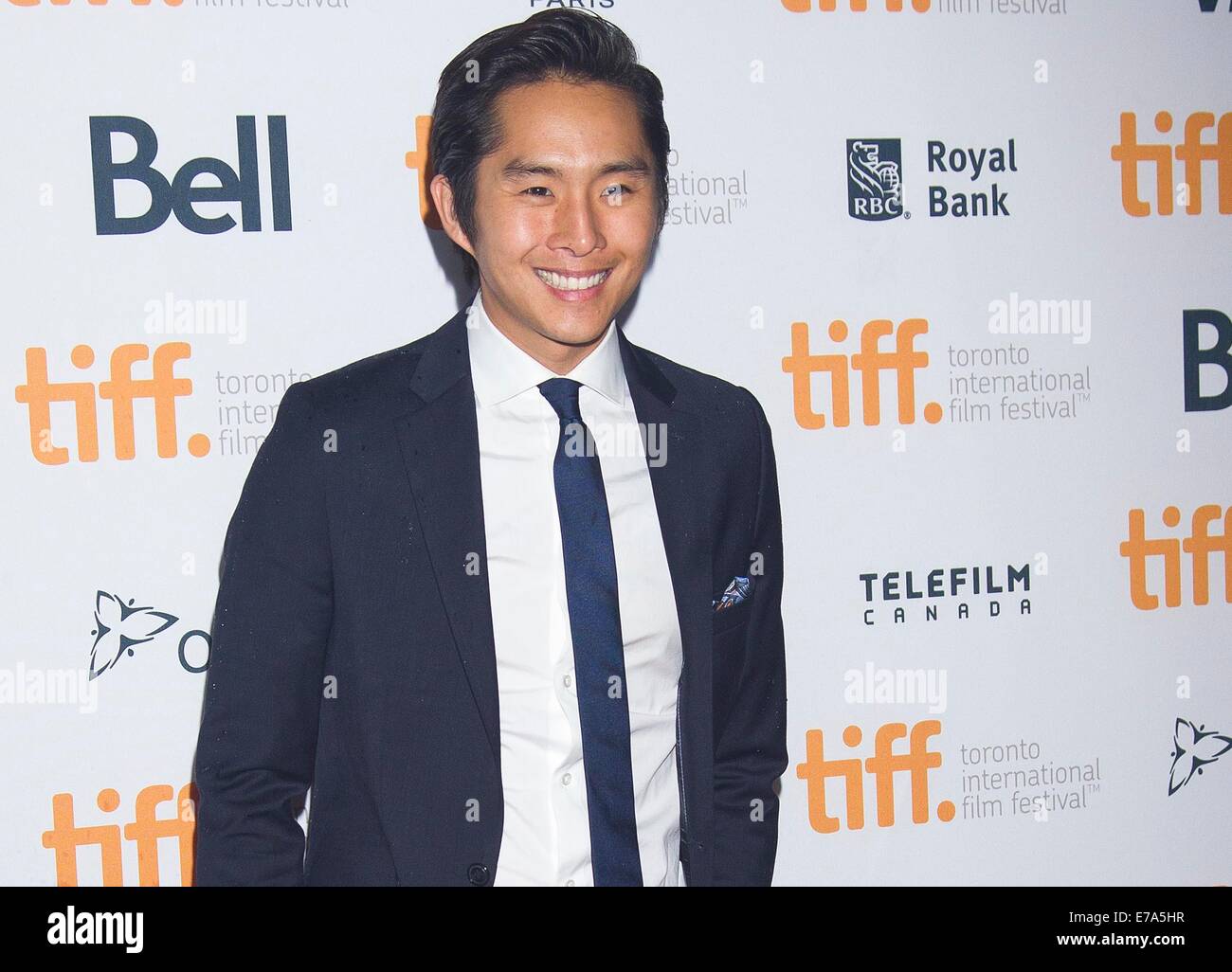 Toronto, Canada. Sep 10, 2014. Acteur Justin Chon pose pour photos avant la première mondiale du film "La Revanche des Dragons vert' à Ryerson Theatre lors de la 39e Festival International du Film de Toronto à Toronto, Canada, le 10 septembre, 2014. Credit : Zou Zheng/Xinhua/Alamy Live News Banque D'Images