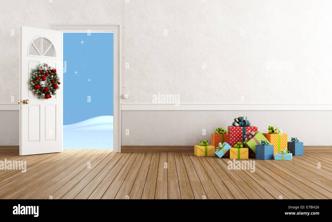 Chambre blanche avec porte ouverte avec plancher en bois cadeau de Noël Banque D'Images