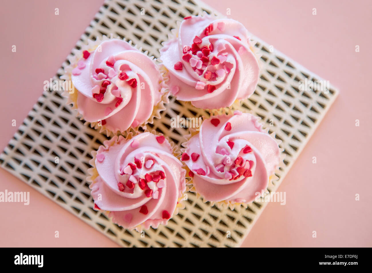 Quatre cupcakes rose Banque D'Images