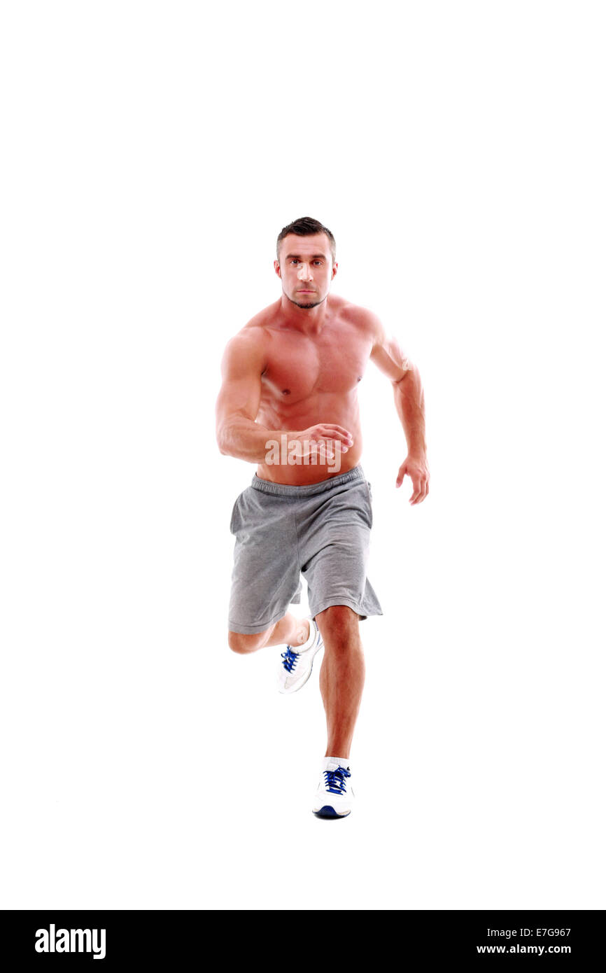 Portrait de jeune homme sportif faisant l'exercice en cours Banque D'Images