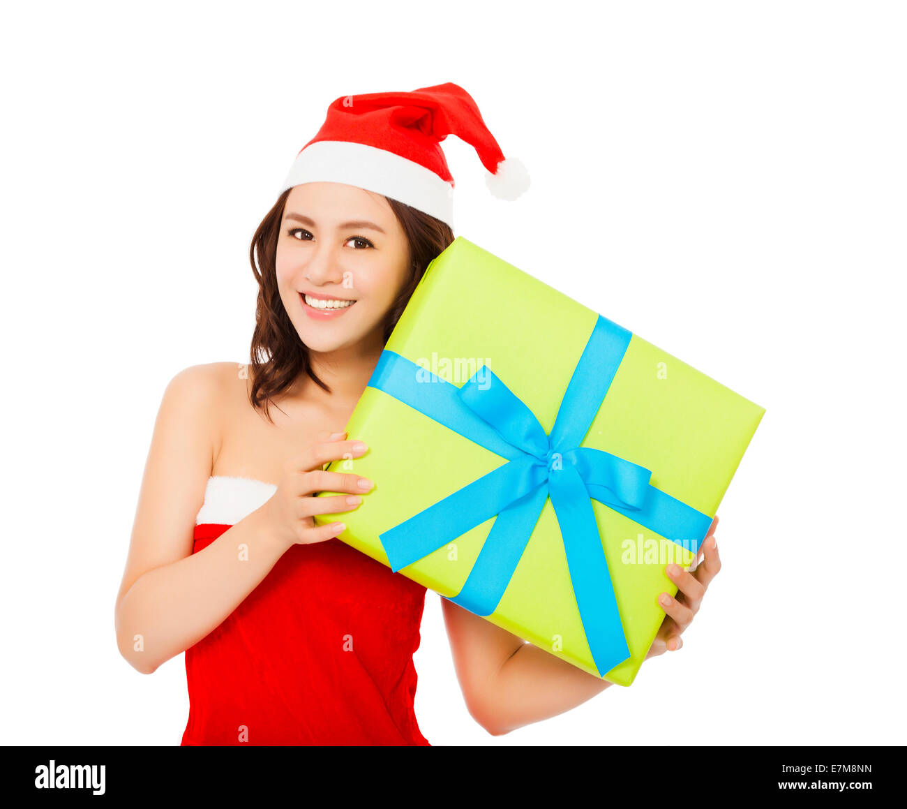 Happy young woman with christmas gift over white background Banque D'Images