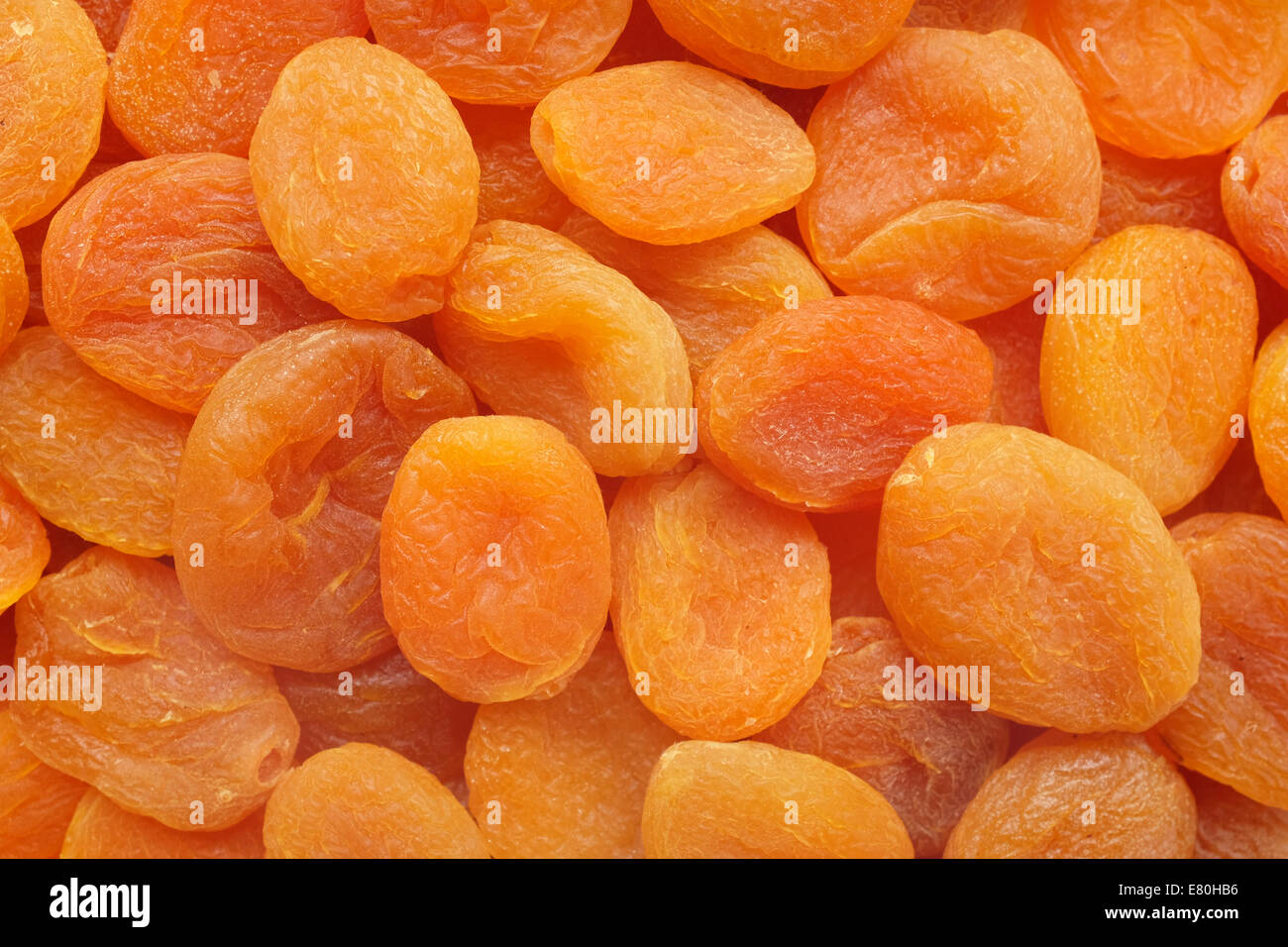 Abricots secs orange profond comme une texture de fond abstrait Banque D'Images