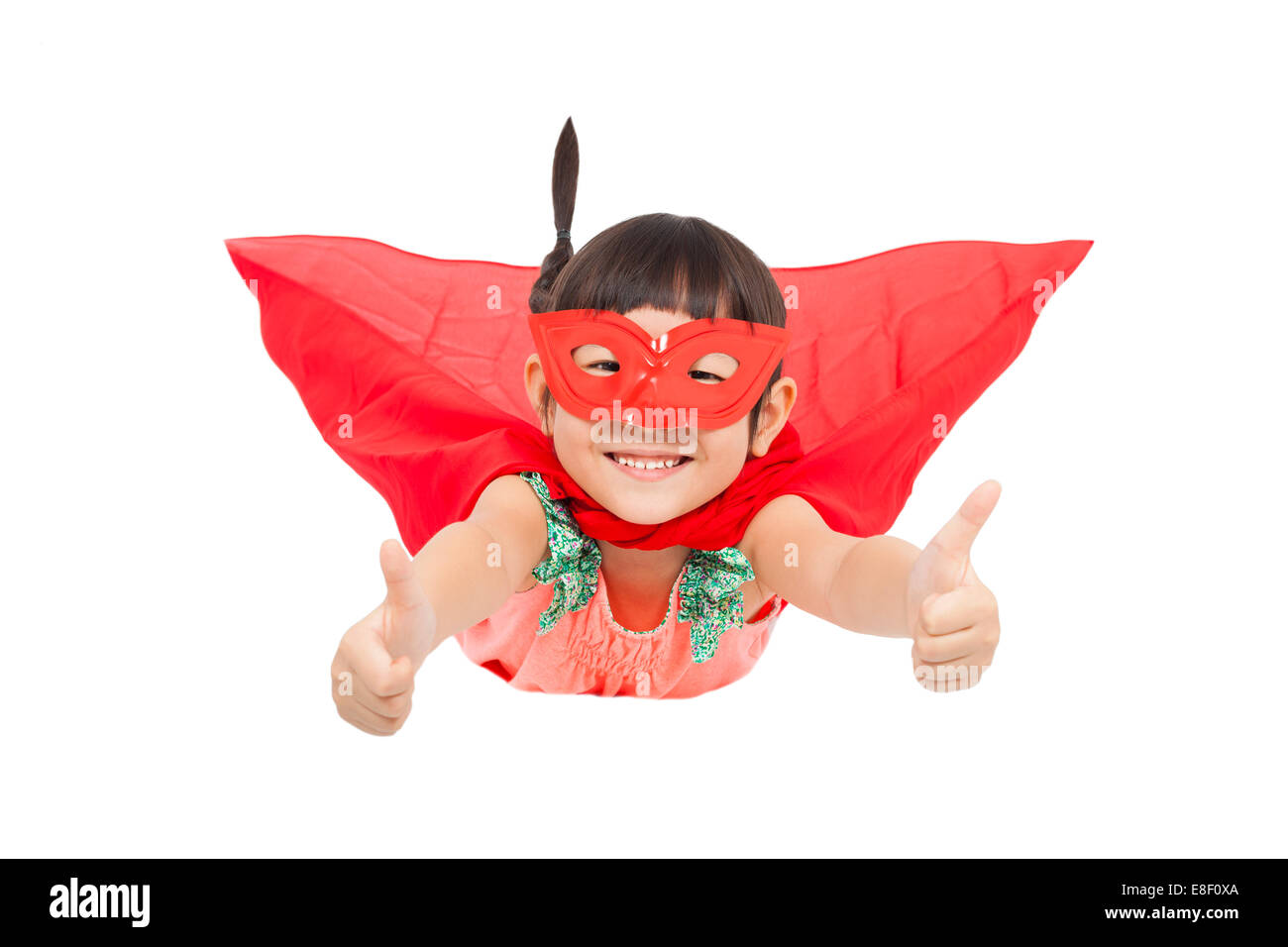 Super héros kid flying et pouce vers le haut. isolé sur fond blanc Banque D'Images