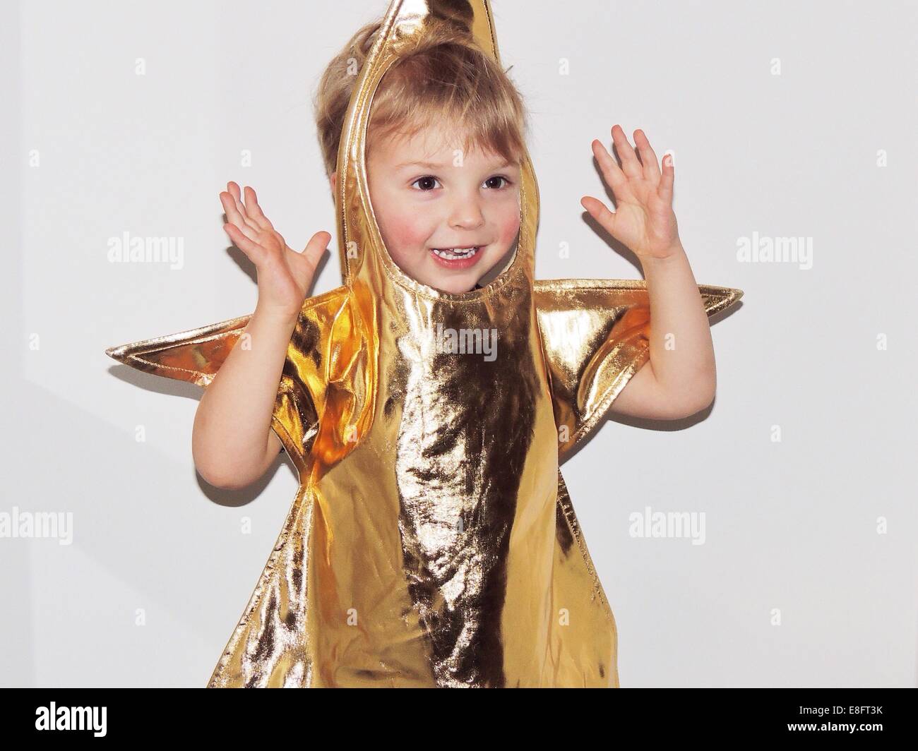 Boy in fancy dress costume étoile d'or Banque D'Images