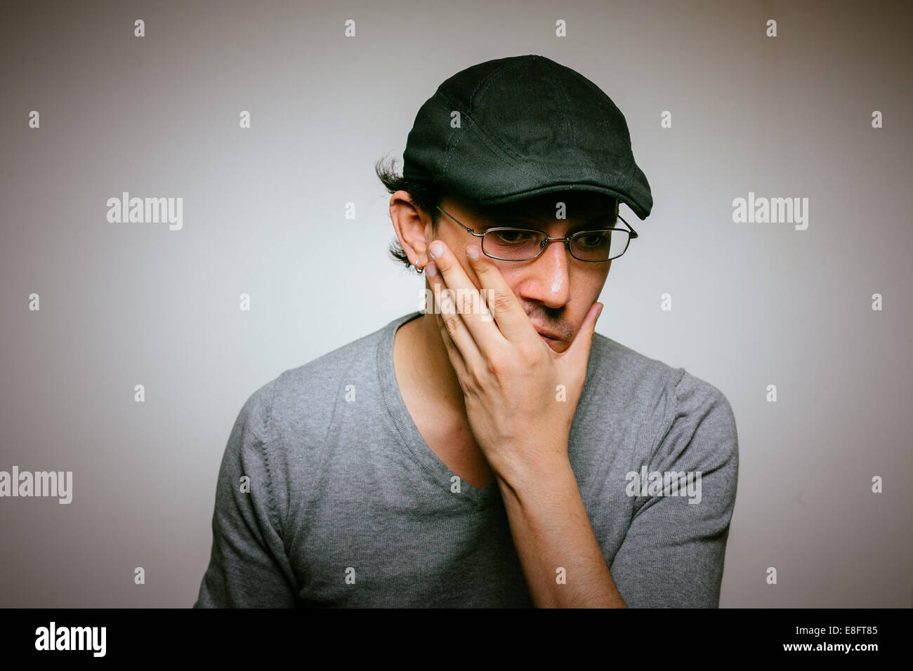 Man with hand on chin, portrait Banque D'Images