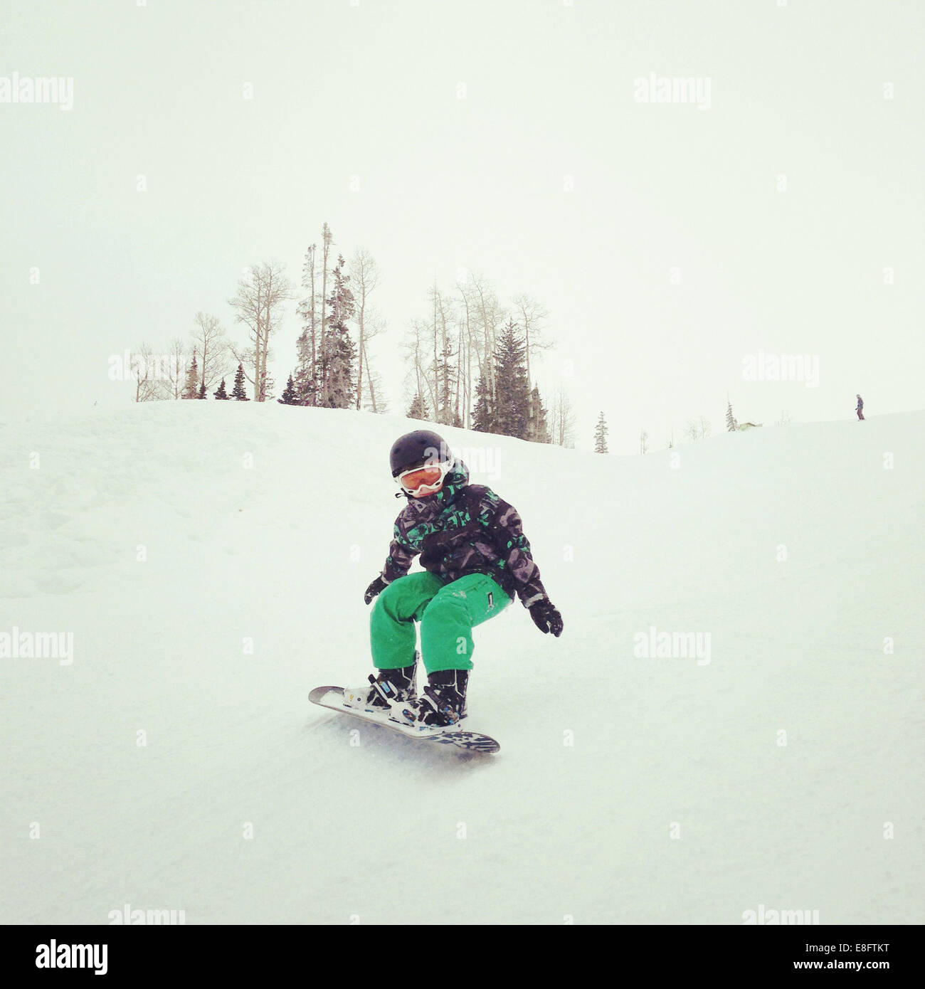 Snowboard Boy Down Hill Banque D'Images