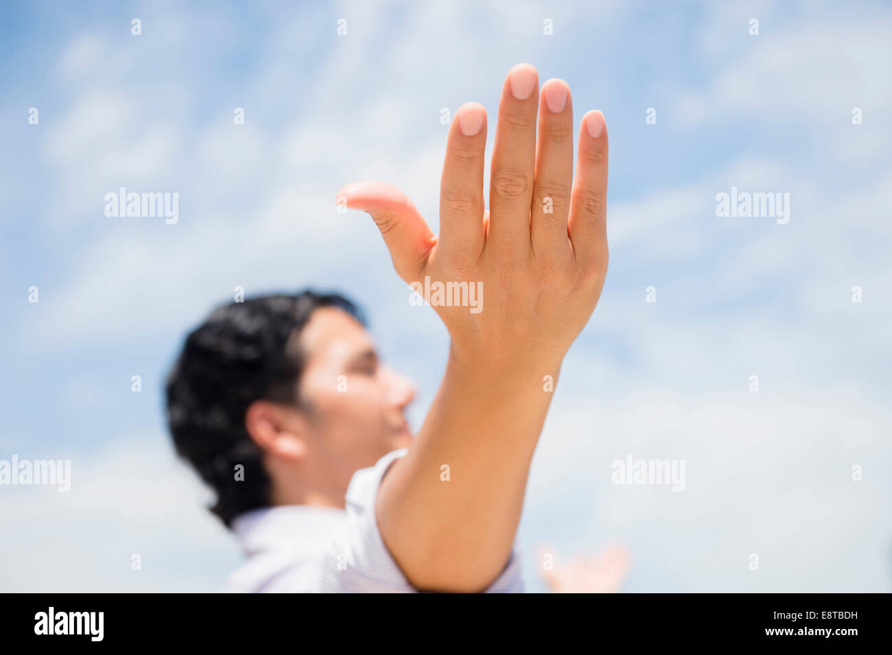 Close up of mixed race man with arms outstretched Banque D'Images
