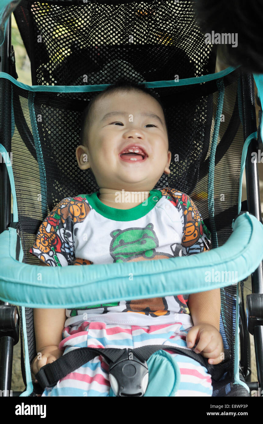 Cute asian baby in stroller Banque D'Images