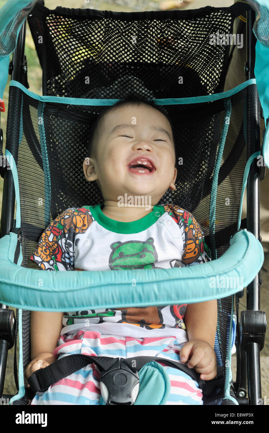 Cute asian baby in stroller Banque D'Images