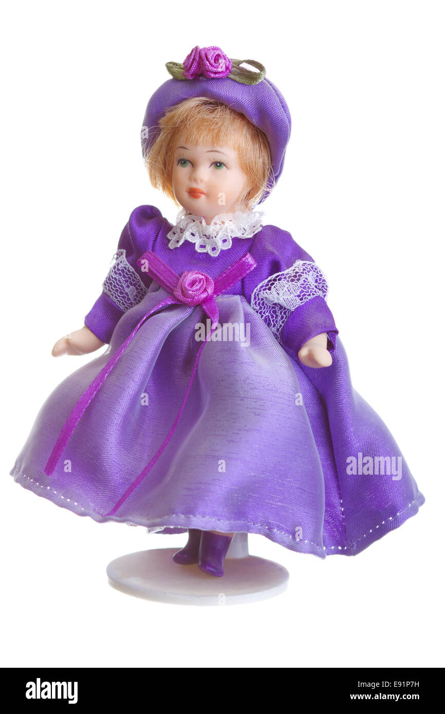 Poupée de porcelaine en robe violette Banque D'Images