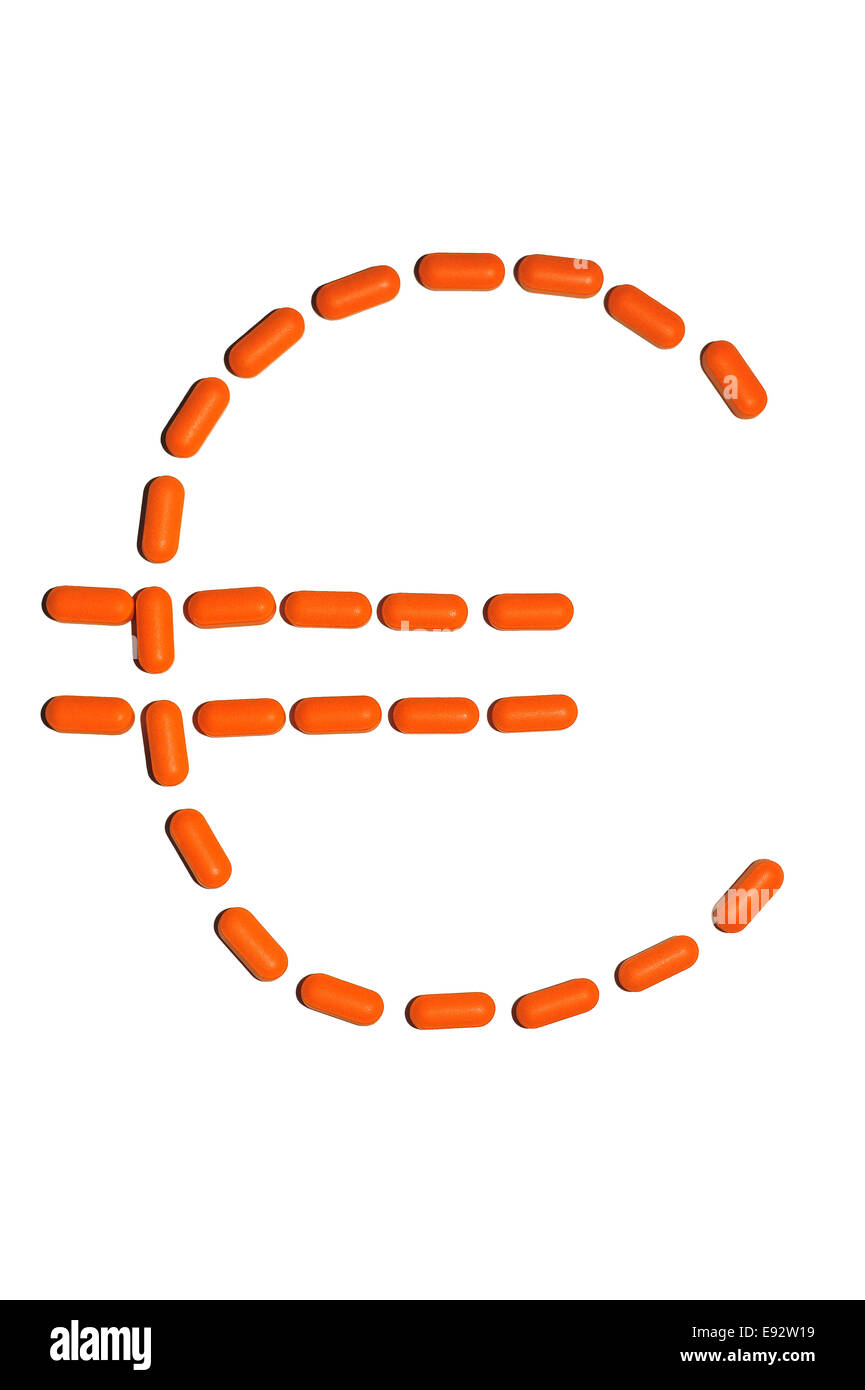 Une image de le symbole monétaire de l'euro a fait de l'orange comprimés médicaux sur un fond blanc. Banque D'Images