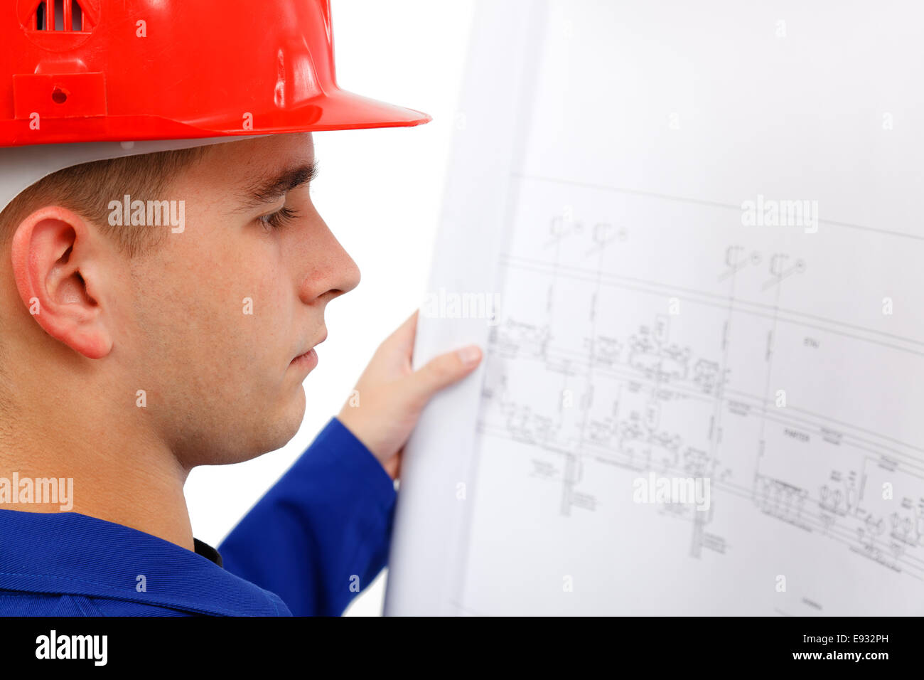 Jeune ingénieur de construction le projet ouvert d'arpentage Banque D'Images