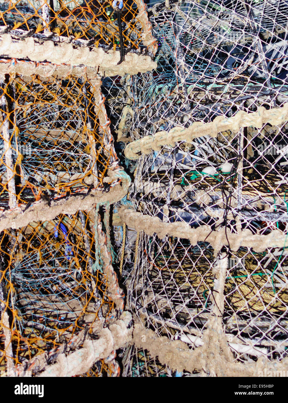 Des casiers à crabe et homard empilés sur le mur du port Torquay UK Banque D'Images
