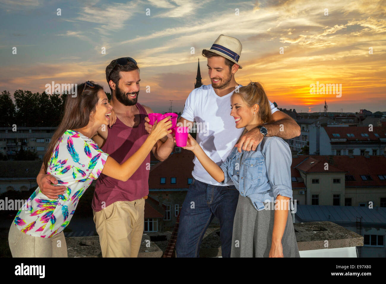 Young people having fun at rooftop party Banque D'Images