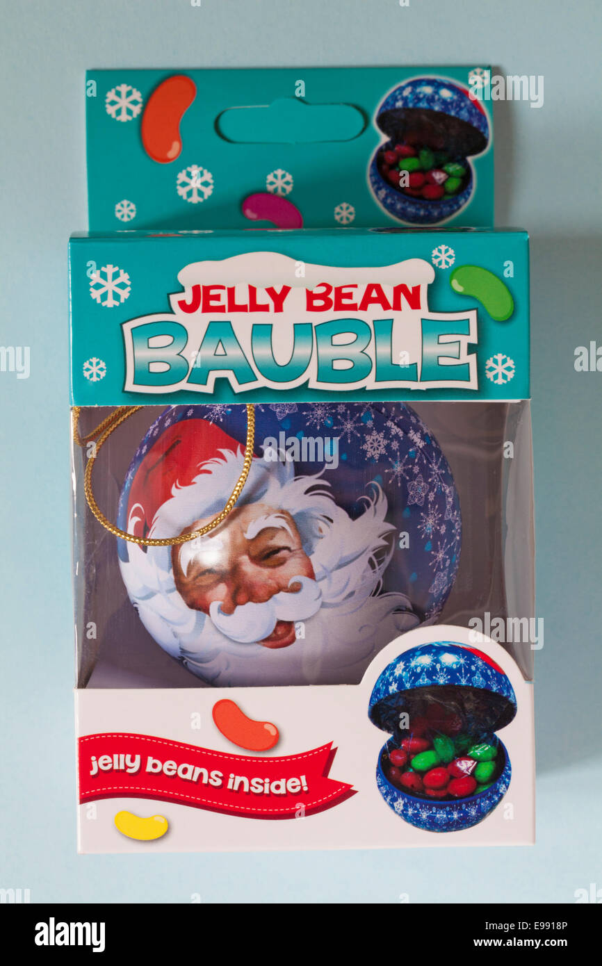 Babiole de Jelly Bean avec le Père Noël dans le visage fort isolé sur fond bleu Banque D'Images