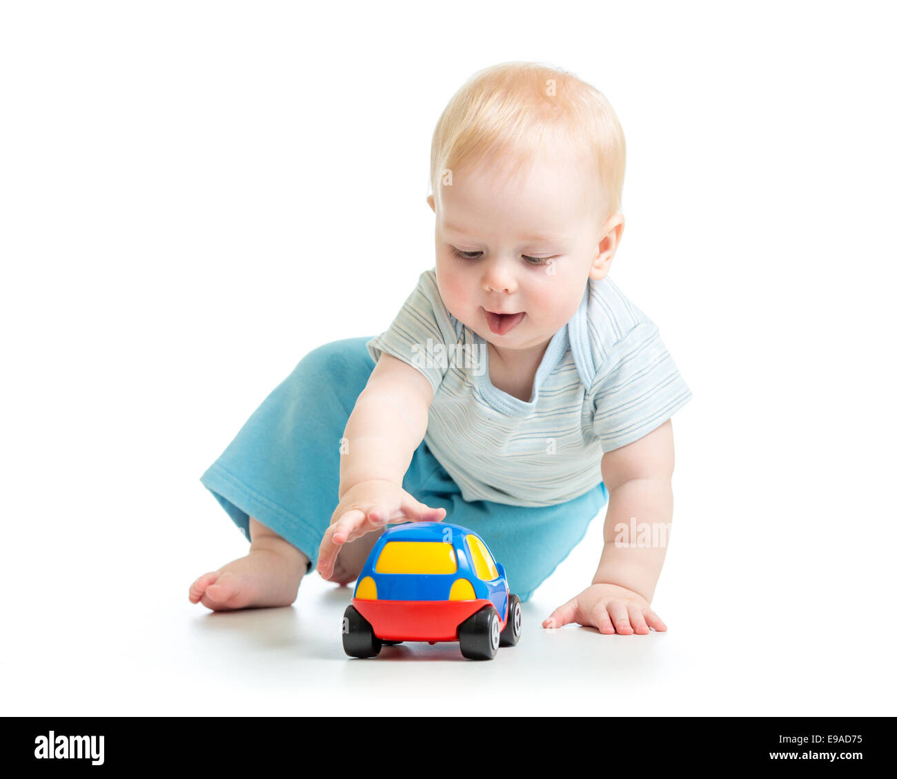 Funny boy kid Playing with toy car Banque D'Images