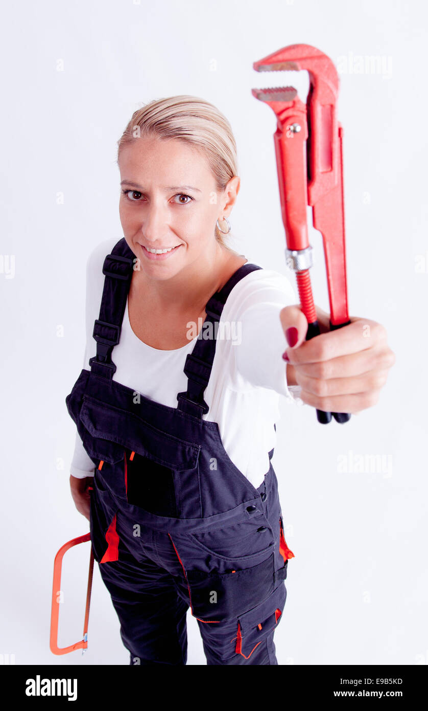 Female construction worker avec des outils sur fond blanc Photo Stock ...