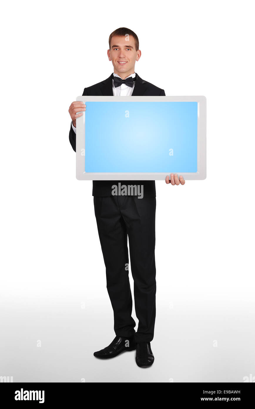 Man in tuxedo holding blank plasma blanc Banque D'Images