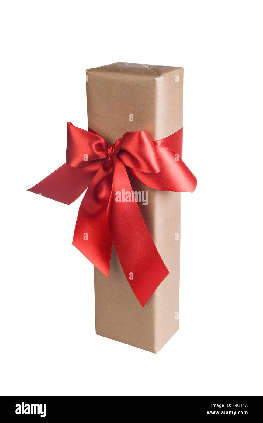 Cadeau de Noël avec un magnifique arc rouge sur fond blanc Banque D'Images