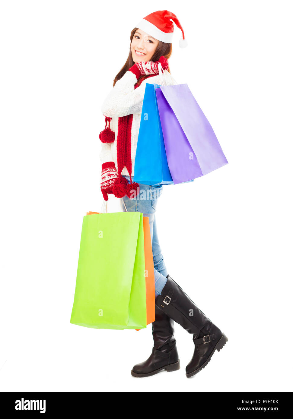 Beautiful happy young woman holding shopping bags Banque D'Images