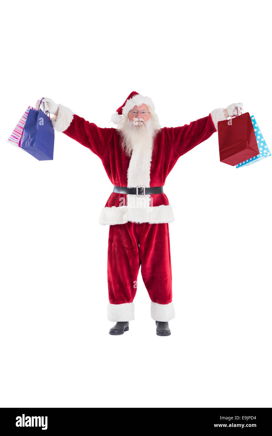 Santa détient quelques sacs pour Noël Banque D'Images