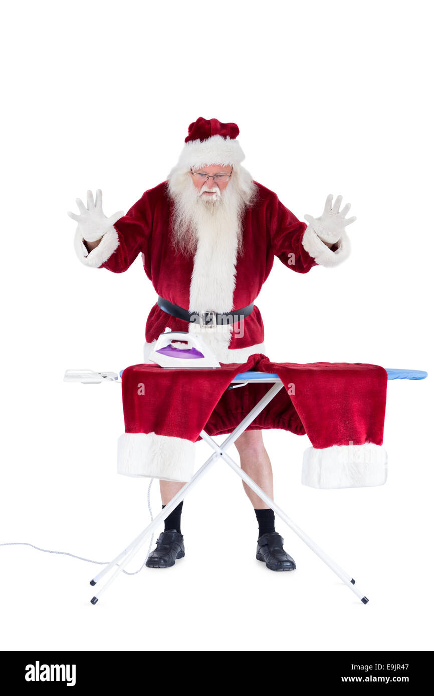 Santa est impressionné à propos de quelque chose sur son pantalon Banque D'Images