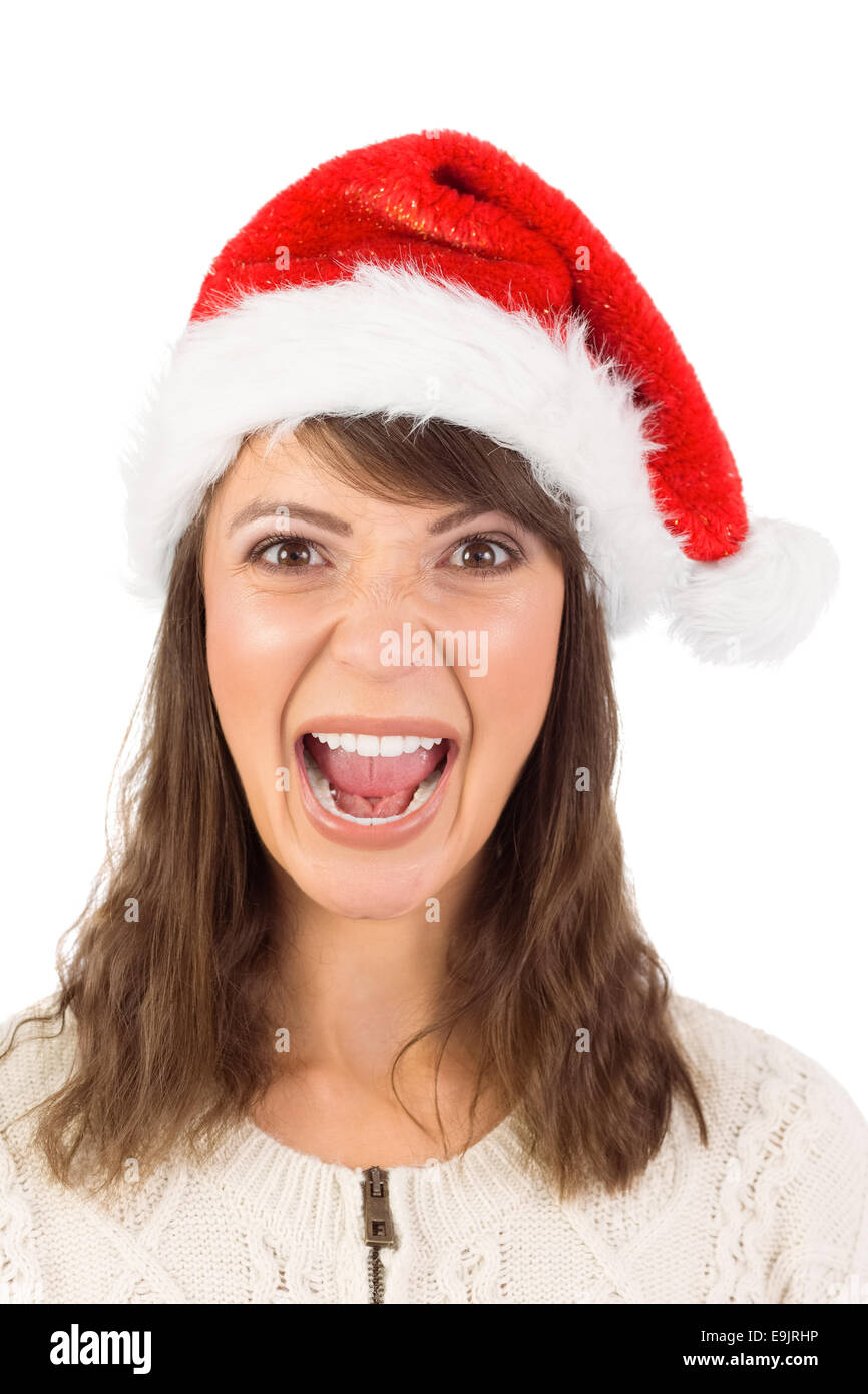 Young woman in santa hat yelling Banque D'Images