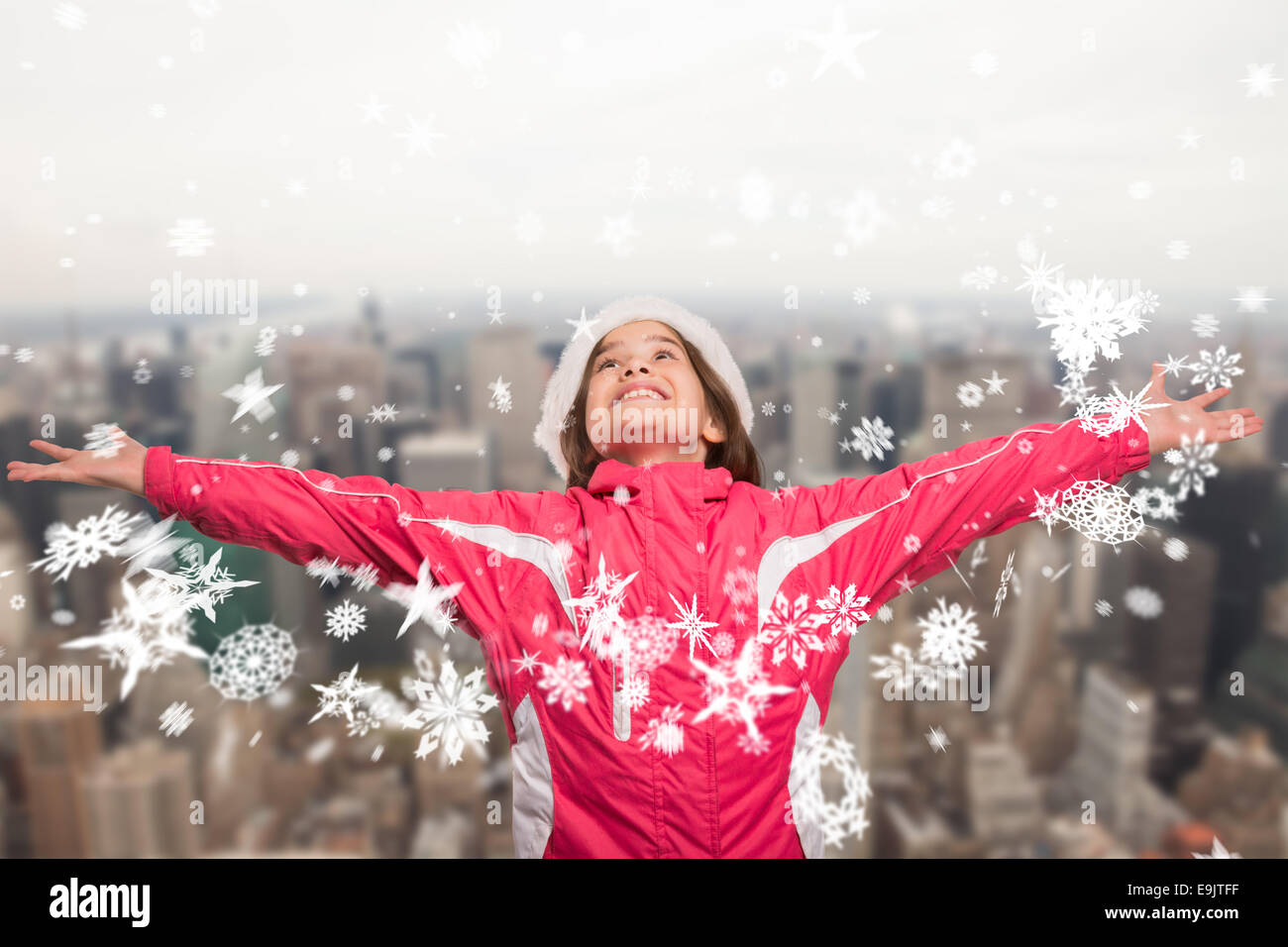 Image composite de jolie fille dans des vêtements d'hiver avec les bras Banque D'Images