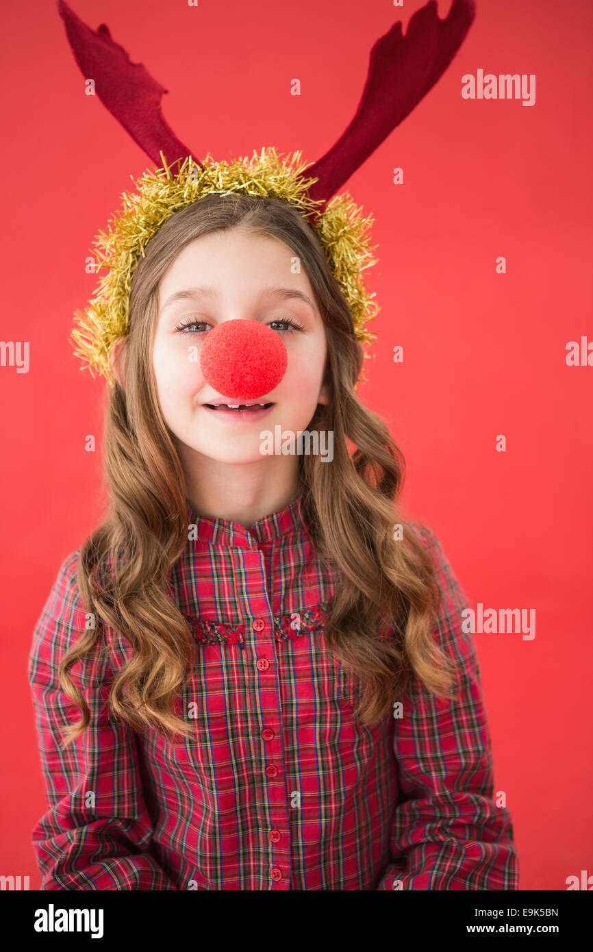 Little girl wearing festif nez rouge Banque D'Images