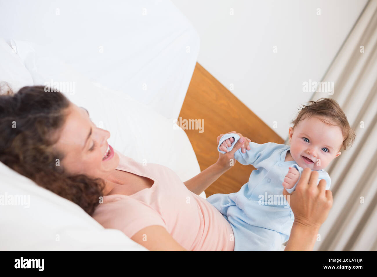 Smiling baby Playing with mother Banque D'Images