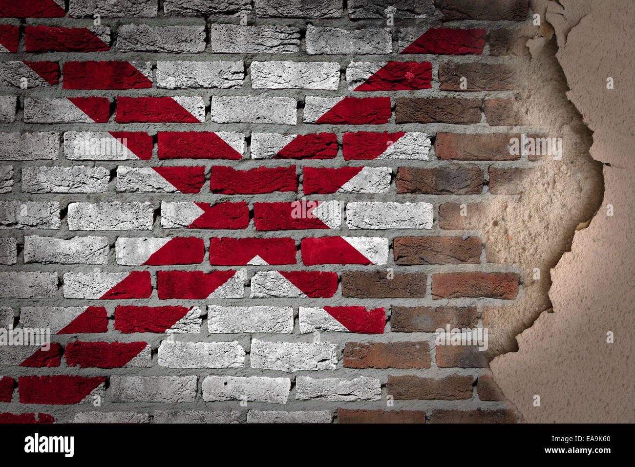La texture du mur de brique sombre avec du plâtre - drapeau peint sur mur - Alabama Banque D'Images