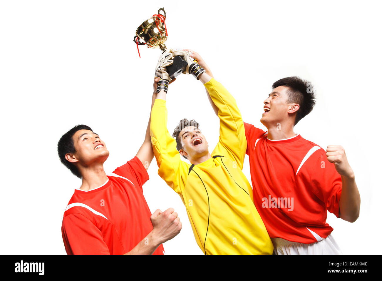 Trois joueurs de football célébrez votre succès Banque D'Images