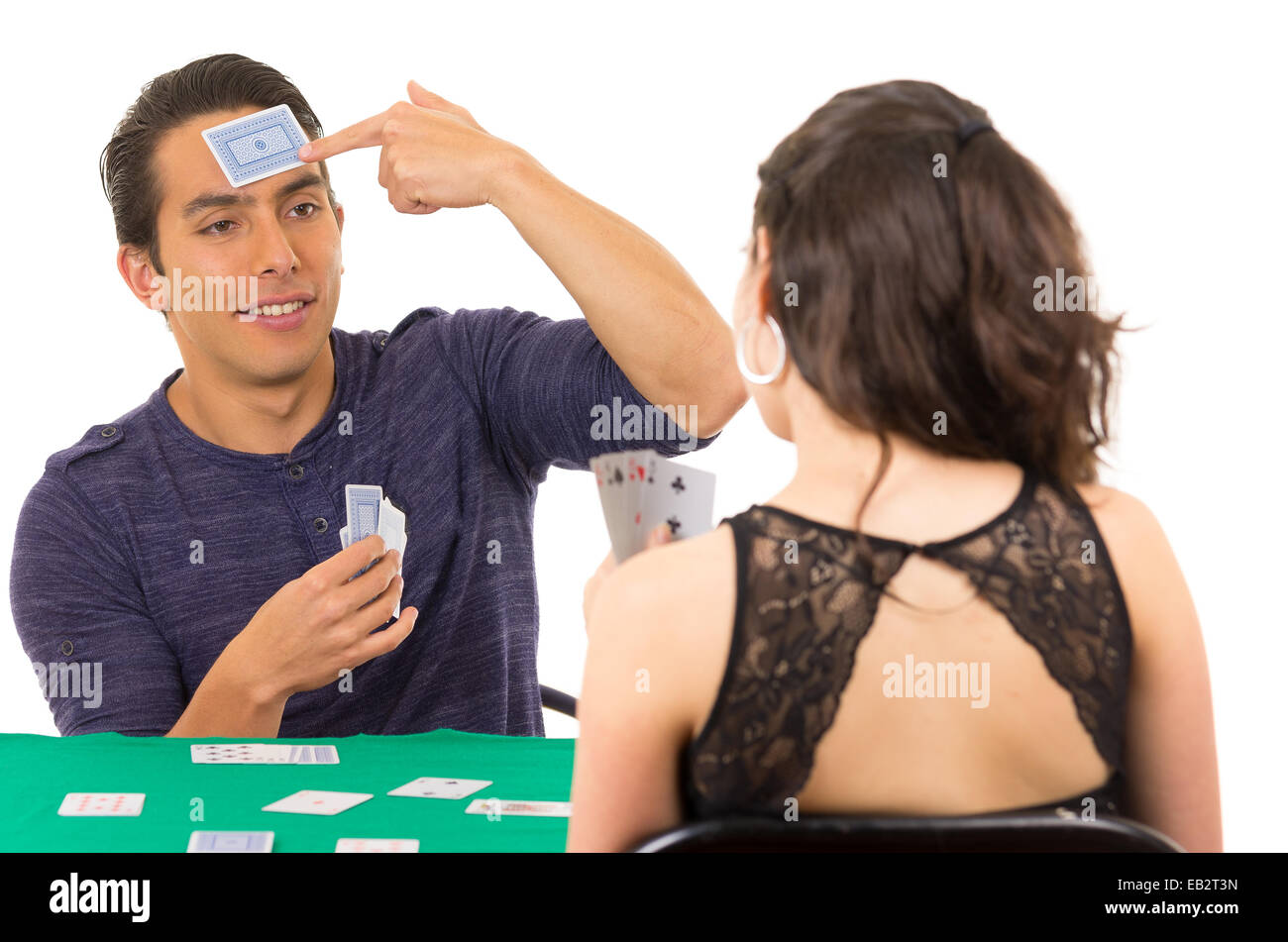 Young couple playing cards cuarenta Banque D'Images