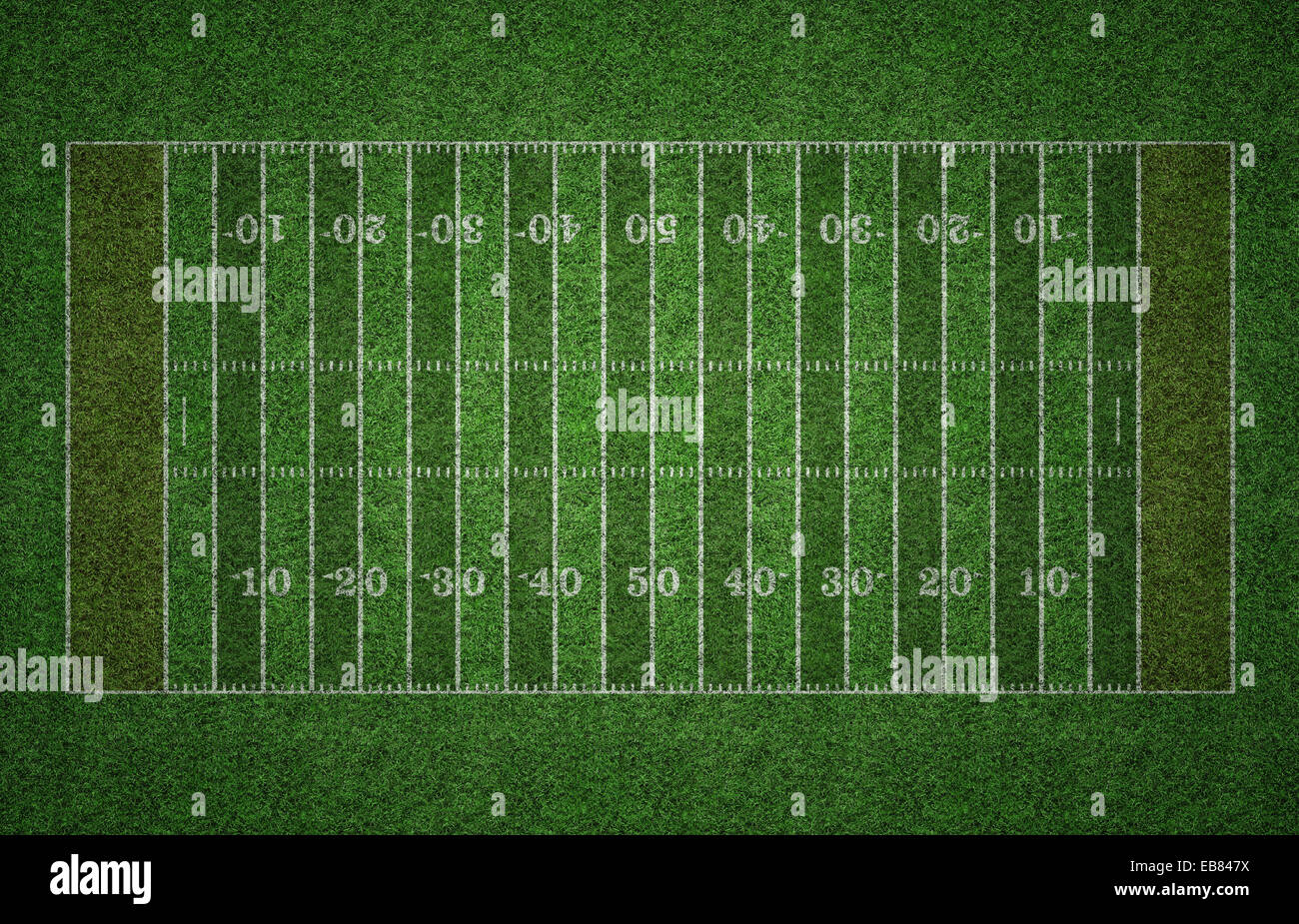 L'herbe verte American football avec des lignes blanches marquant le pas. Banque D'Images