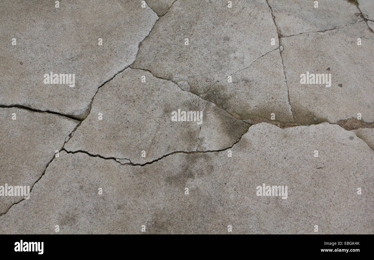 Ancien du ciment gris avec des fissures texture Banque D'Images