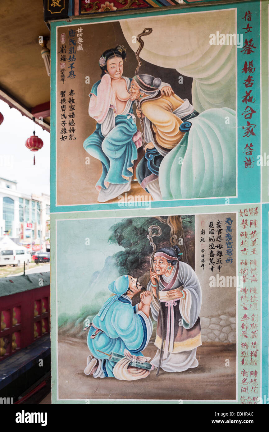 Histoire de bord en chinois sur mur de temple chinois de Tua Pek Kong, Miri, Sarawak, Malaisie Banque D'Images
